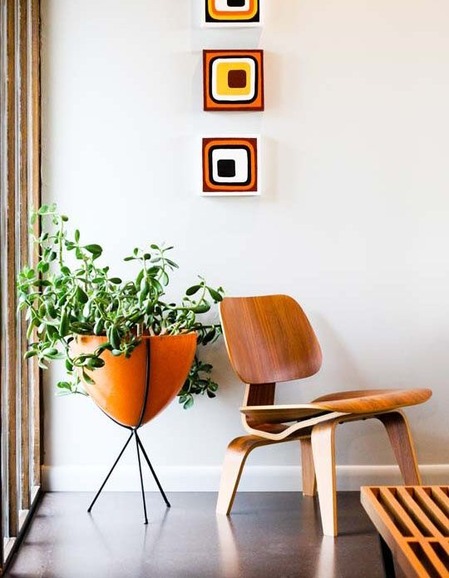 bullet planter behind the chair